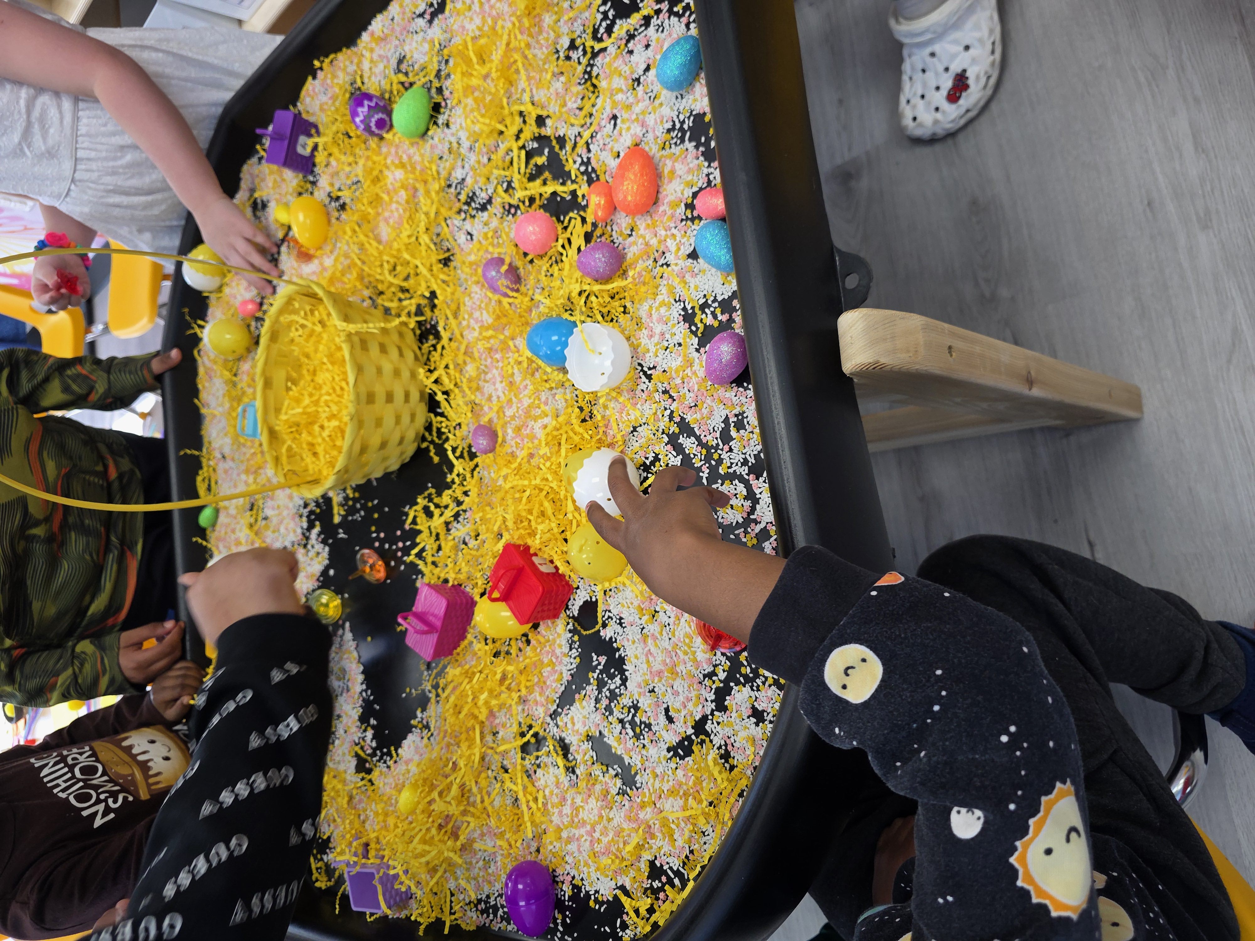 Children exploring hands-on sensory materials